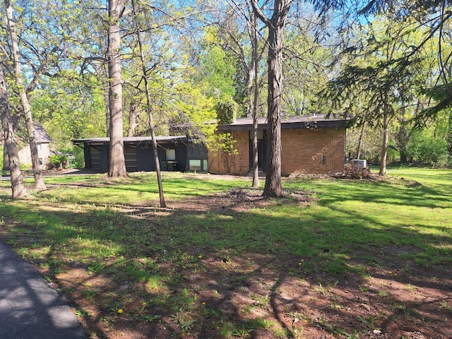 2065 Hickory Ln, Schaumburg, IL 60195 - view of front of house with a front lawn and brick siding