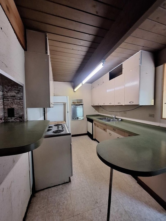 2065 Hickory Ln, Schaumburg, IL 60195 - kitchen with wood ceiling, a sink, white cabinetry, light tile patterned floors, and beam ceiling