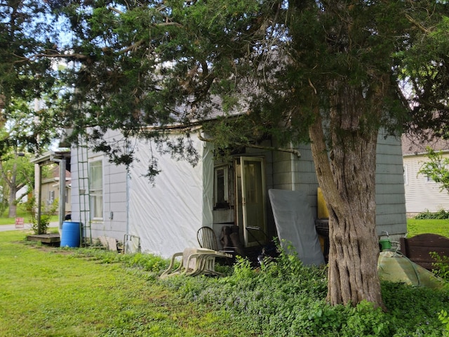 926 Division St, Charleston, IL 61920 - view of home's exterior featuring a yard