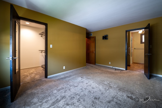 2031 W Winchester Dr, Freeport, IL 61032 - unfurnished bedroom featuring carpet floors and baseboards