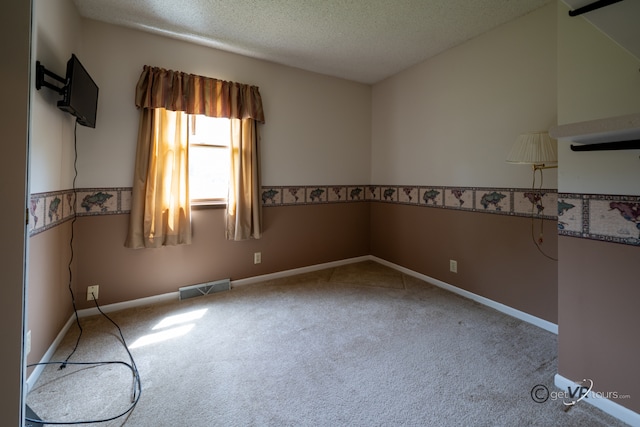 2031 W Winchester Dr, Freeport, IL 61032 - empty room with carpet flooring, a textured ceiling, and baseboards