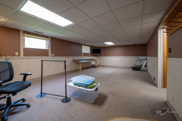 2031 W Winchester Dr, Freeport, IL 61032 - recreation room featuring carpet flooring, a wainscoted wall, healthy amount of natural light, and a drop ceiling