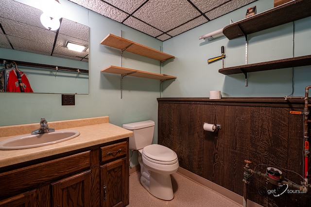 2031 W Winchester Dr, Freeport, IL 61032 - bathroom featuring toilet, a drop ceiling, and vanity