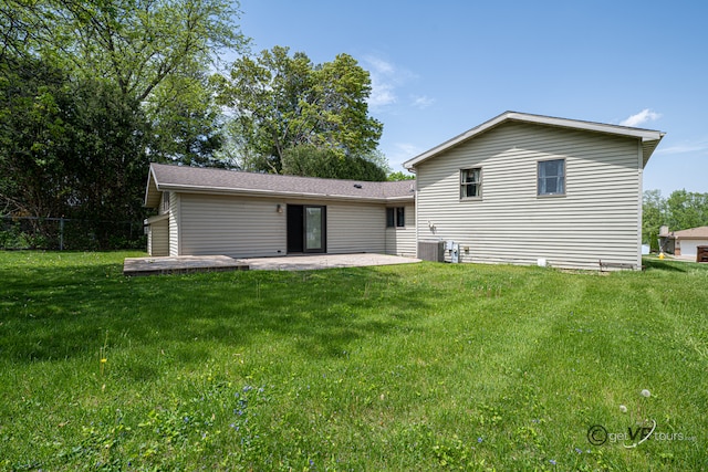 2031 W Winchester Dr, Freeport, IL 61032 - rear view of house with a patio area and central AC unit