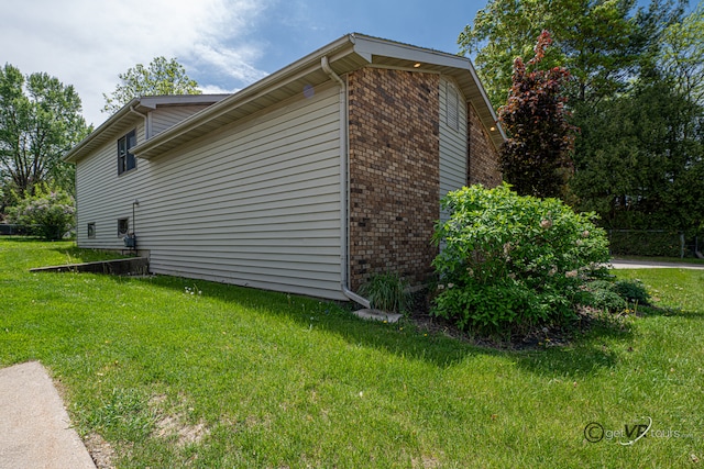 2031 W Winchester Dr, Freeport, IL 61032 - view of side of property with brick siding and a yard