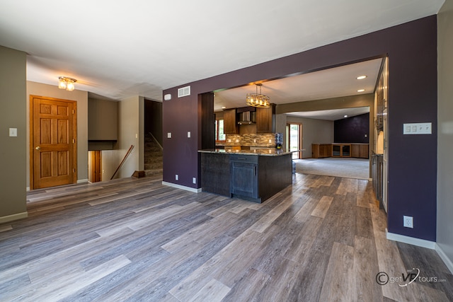 2031 W Winchester Dr, Freeport, IL 61032 - kitchen with open floor plan, dark wood-style flooring, baseboards, and light stone countertops