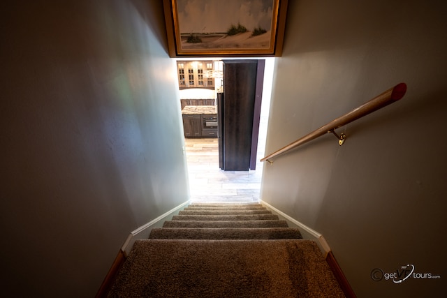 2031 W Winchester Dr, Freeport, IL 61032 - stairway featuring carpet flooring and baseboards