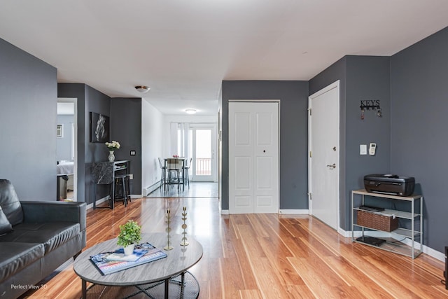 370 Echo Ln Unit 3, Aurora, IL 60504 - living area with light wood-style flooring and baseboards