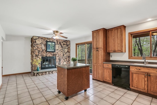 2030 Burke Dr, Winthrop Harbor, IL 60096 - kitchen with dishwasher, a sink, dark countertops, ceiling fan, and brown cabinets