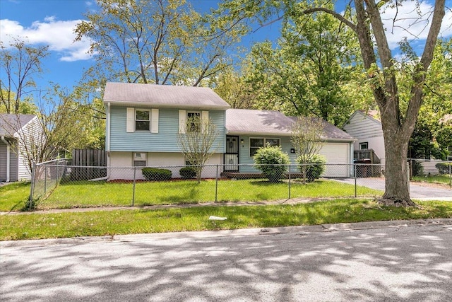 tri-level home featuring a garage and concrete driveway