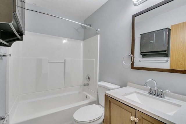bathroom with toilet, vanity, and  shower combination