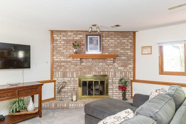 carpeted living area featuring a fireplace