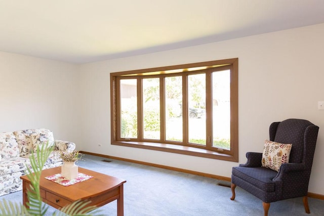 living room featuring plenty of natural light and baseboards