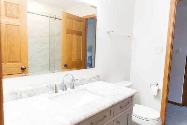bathroom with toilet and vanity