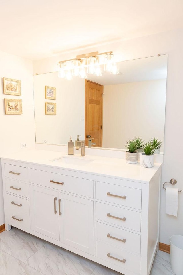 bathroom featuring vanity and marble look tile flooring