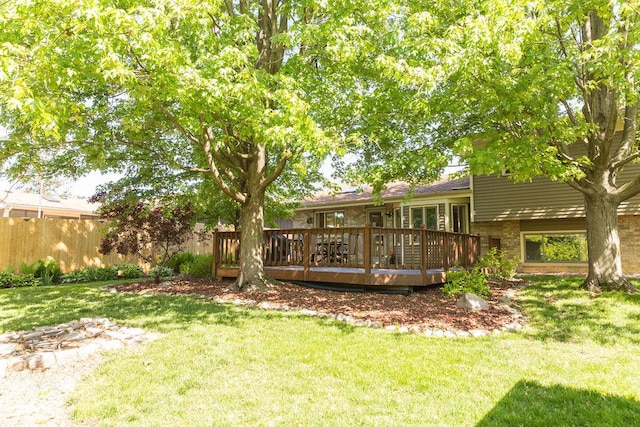 view of yard featuring a wooden deck