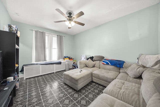 5815 W Roosevelt Rd, Cicero, IL 60804 - living room featuring a ceiling fan, radiator, and baseboards
