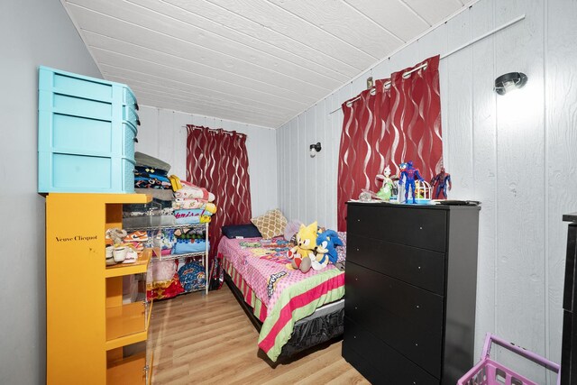 5815 W Roosevelt Rd, Cicero, IL 60804 - bedroom with wood finished floors, lofted ceiling, and wooden walls