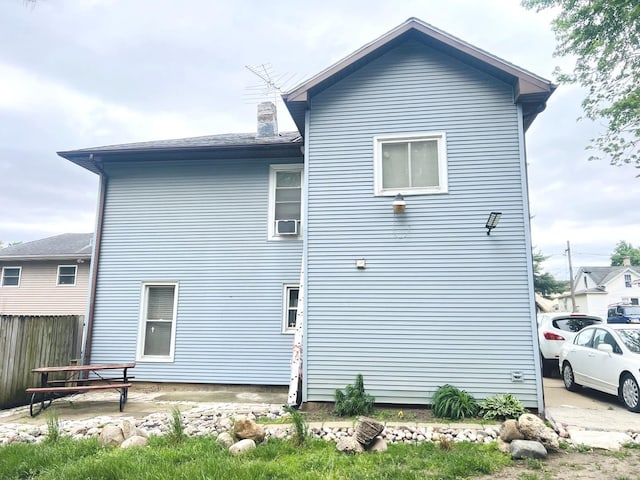 405 Oscar Ave, Joliet, IL 60433 - view of side of property featuring fence and a chimney