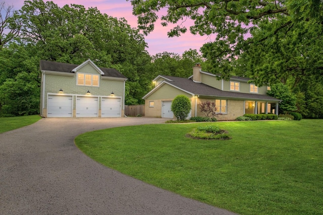 2S579 Partridge Rd, Batavia, IL 60510 - traditional-style house featuring driveway, a garage, a yard, and brick siding