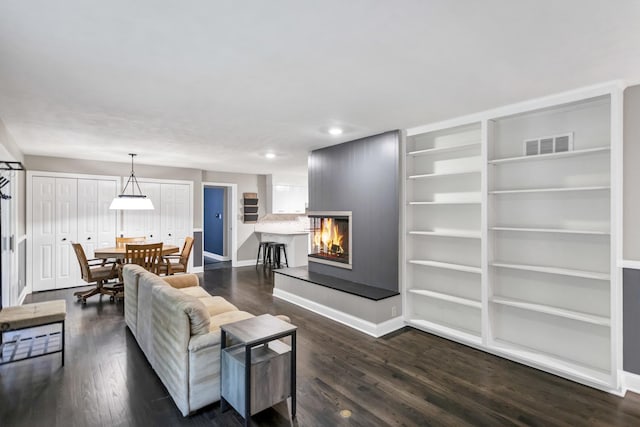 2S579 Partridge Rd, Batavia, IL 60510 - living room with a lit fireplace, baseboards, dark wood-style floors, and recessed lighting