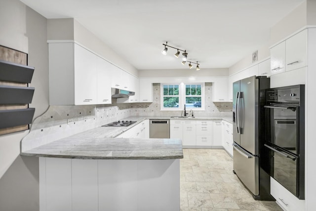2S579 Partridge Rd, Batavia, IL 60510 - kitchen with black appliances, a peninsula, under cabinet range hood, tasteful backsplash, and light stone countertops