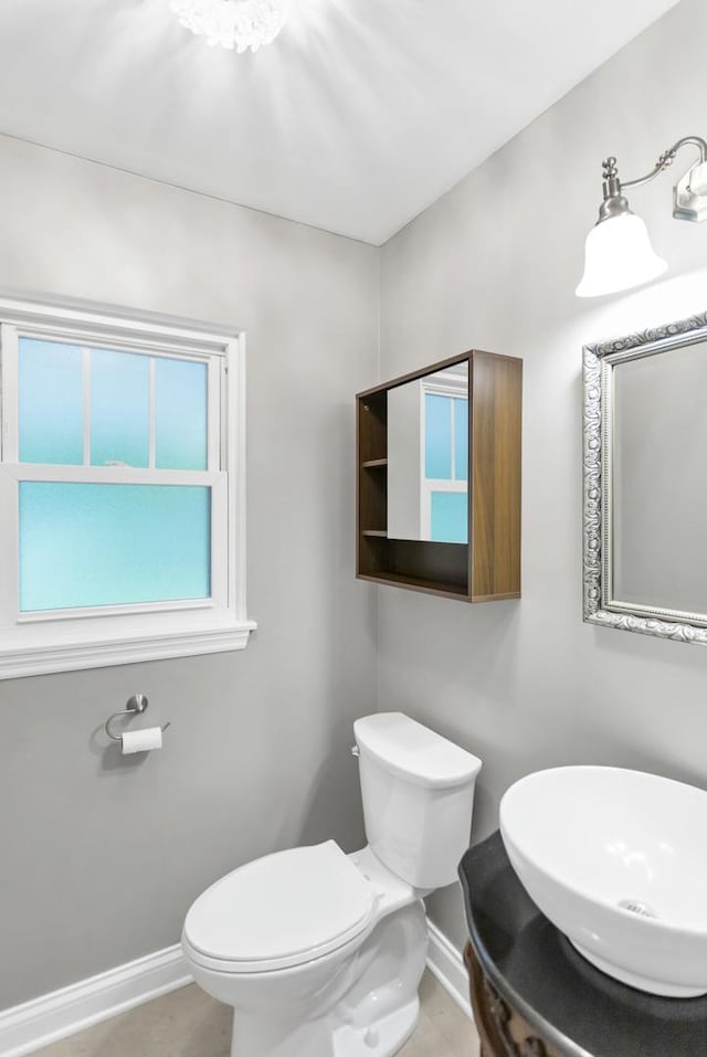 2S579 Partridge Rd, Batavia, IL 60510 - bathroom with baseboards, toilet, and a sink