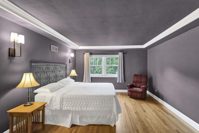 2S579 Partridge Rd, Batavia, IL 60510 - bedroom featuring a raised ceiling, wood finished floors, baseboards, and ornamental molding