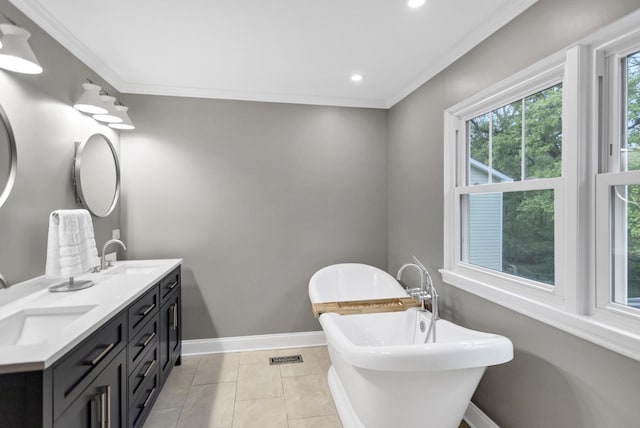 2S579 Partridge Rd, Batavia, IL 60510 - bathroom featuring double vanity, a soaking tub, recessed lighting, baseboards, and crown molding