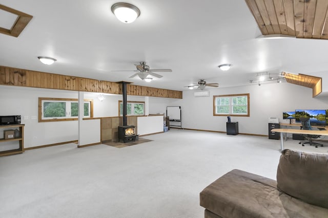 2S579 Partridge Rd, Batavia, IL 60510 - living area featuring a wood stove, light carpet, baseboards, and a ceiling fan
