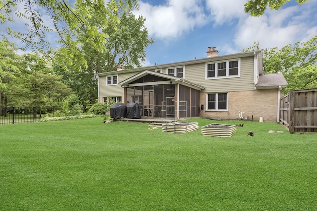 2S579 Partridge Rd, Batavia, IL 60510 - rear view of house featuring a sunroom, a chimney, and brick siding