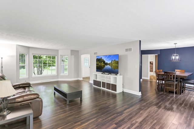2S579 Partridge Rd, Batavia, IL 60510 - living area with wood finished floors, baseboards, and a chandelier
