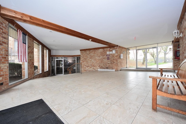 1103 S Hunt Club Dr Unit 127, Mount Prospect, IL 60056 - unfurnished living room featuring brick wall and beam ceiling