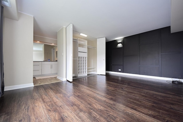 1103 S Hunt Club Dr Unit 127, Mount Prospect, IL 60056 - unfurnished living room with wood finished floors and baseboards