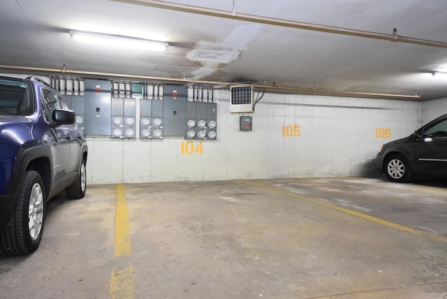 1103 S Hunt Club Dr Unit 127, Mount Prospect, IL 60056 - parking garage featuring electric panel and a garage door opener