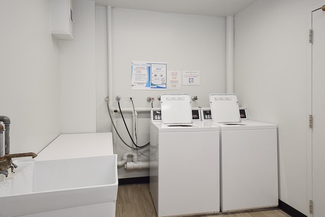 1103 S Hunt Club Dr Unit 127, Mount Prospect, IL 60056 - shared laundry featuring light wood finished floors and washing machine and clothes dryer