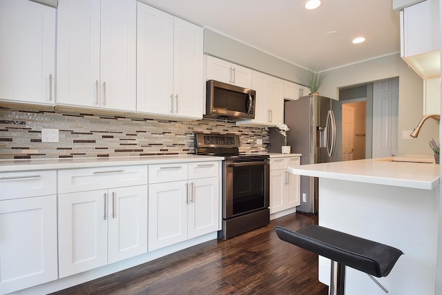 1103 S Hunt Club Dr Unit 127, Mount Prospect, IL 60056 - kitchen featuring stainless steel appliances, a sink, dark wood-style flooring, recessed lighting, and decorative backsplash