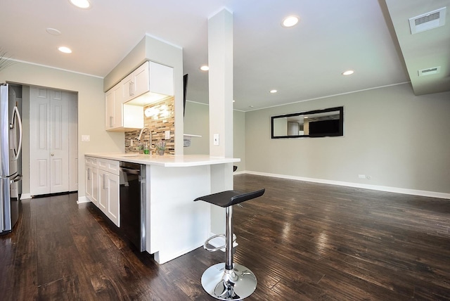 1103 S Hunt Club Dr Unit 127, Mount Prospect, IL 60056 - kitchen featuring stainless steel appliances, dark wood-type flooring, white cabinets, a kitchen breakfast bar, and baseboards