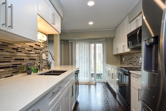 1103 S Hunt Club Dr Unit 127, Mount Prospect, IL 60056 - kitchen featuring stainless steel fridge with ice dispenser, black electric range, a sink, decorative backsplash, and recessed lighting