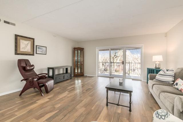 400 S NW Hwy Unit 309, Park Ridge, IL 60068 - living area featuring baseboards and wood finished floors