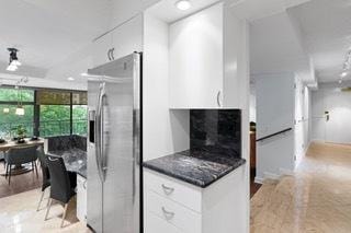 1430 N Astor St Unit 7A, Chicago, IL 60610 - kitchen with stainless steel fridge, white cabinets, freestanding refrigerator, and a fireplace