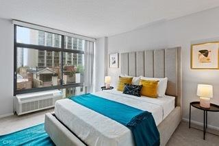 1430 N Astor St Unit 7A, Chicago, IL 60610 - carpeted bedroom with multiple windows and baseboards