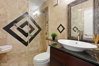 1430 N Astor St Unit 7A, Chicago, IL 60610 - bathroom featuring tile walls, vanity, and toilet