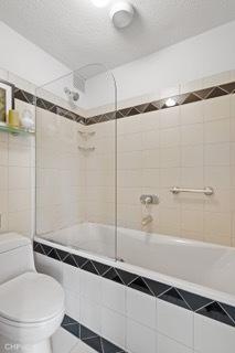 1430 N Astor St Unit 7A, Chicago, IL 60610 - full bath with toilet, tile patterned floors, and tiled shower / bath combo