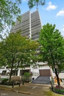 1430 N Astor St Unit 7A, Chicago, IL 60610 - view of property featuring a garage and driveway