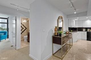 1430 N Astor St Unit 7A, Chicago, IL 60610 - kitchen with track lighting and white cabinetry