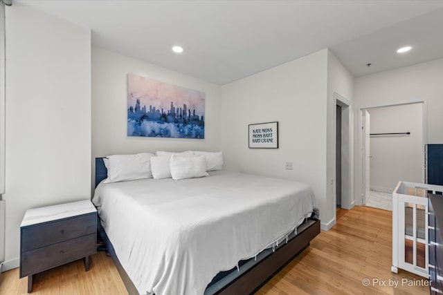 653 N Kingsbury St Unit 706, Chicago, IL 60654 - bedroom with light wood-type flooring, recessed lighting, and baseboards