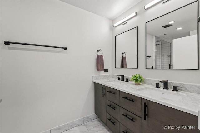 653 N Kingsbury St Unit 706, Chicago, IL 60654 - bathroom featuring double vanity, marble look tiles, a shower stall, and baseboards
