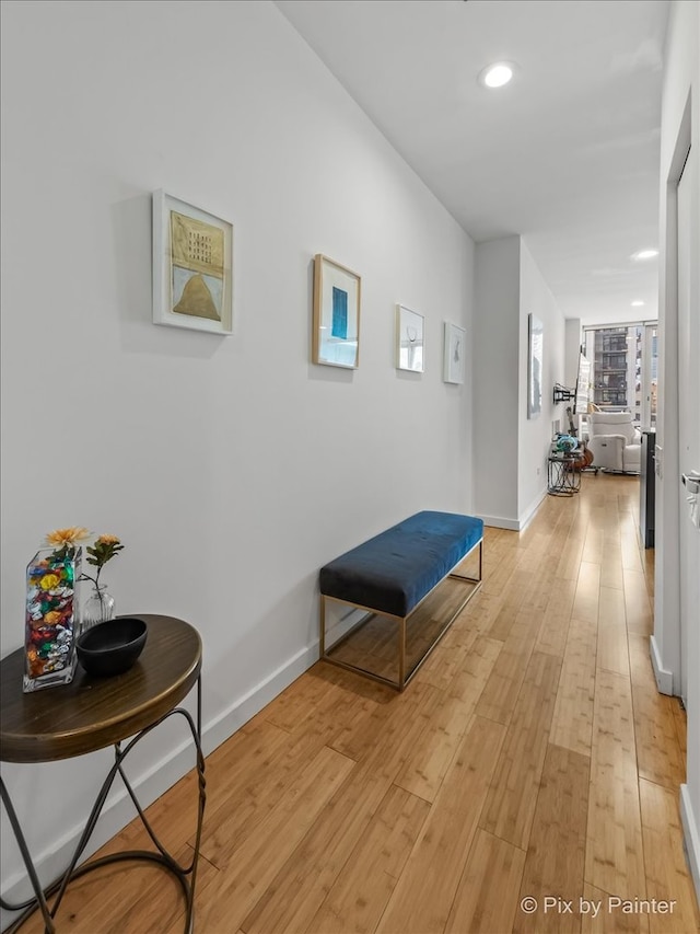 653 N Kingsbury St Unit 706, Chicago, IL 60654 - hallway featuring light wood-style flooring, baseboards, and recessed lighting