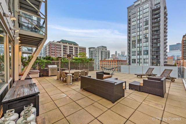 653 N Kingsbury St Unit 706, Chicago, IL 60654 - view of patio featuring a city view, an outdoor living space, area for grilling, and outdoor dining space